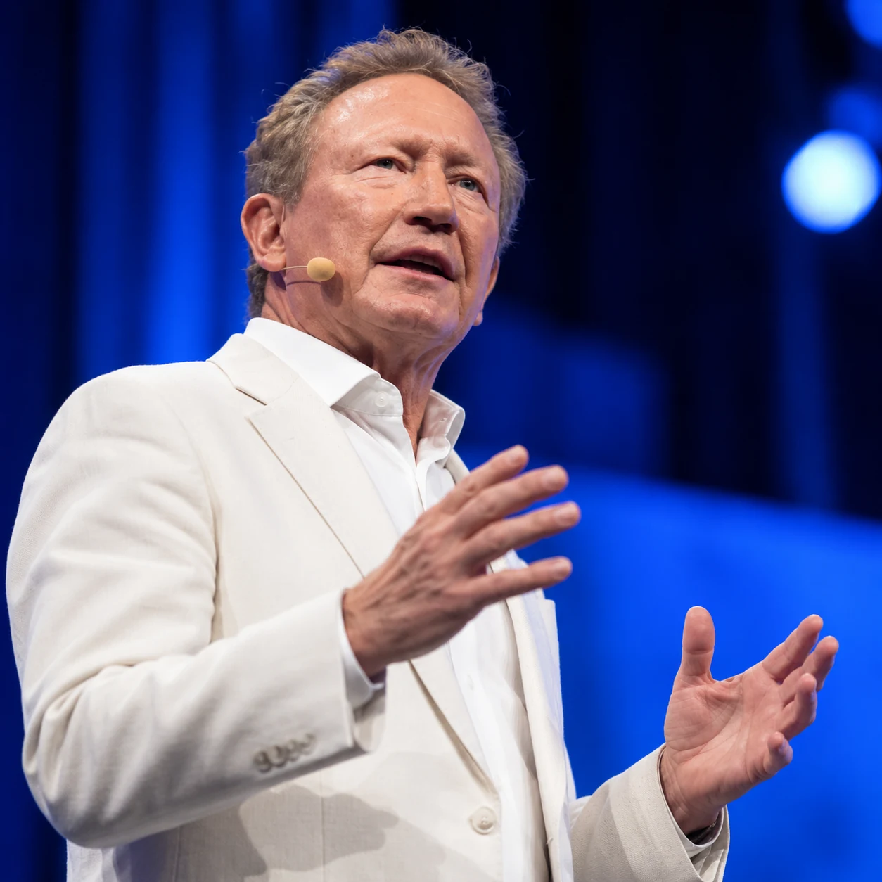 Andrew Forrest speaking on stage during a public event