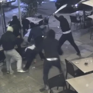 CCTV-style scene of a machete attack outside an Oakleigh dessert bar