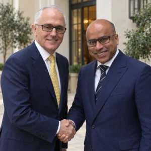 Sanjeev Gupta and Malcolm Turnbull posing together in suits